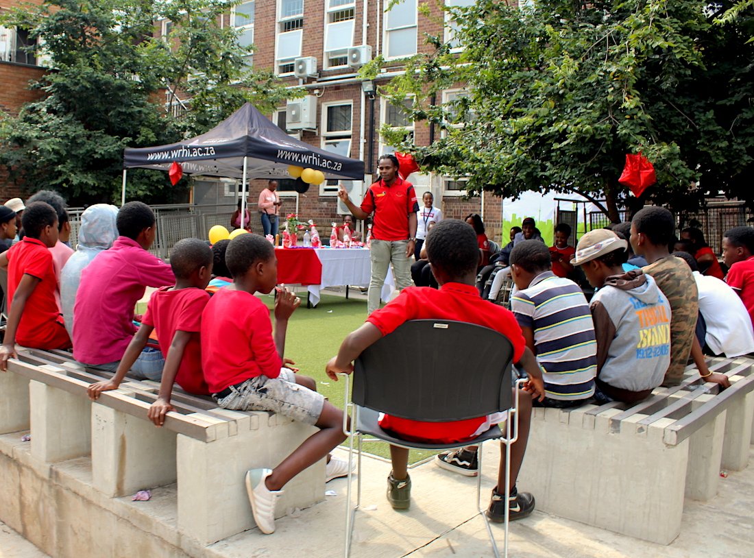 An instructor tells students about HIV prevention